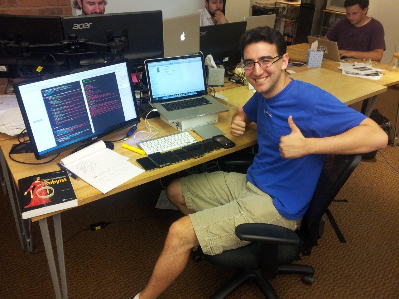 Our iOS developer Zach testing DeleteMe Mobile on a bunch of our iPhones.